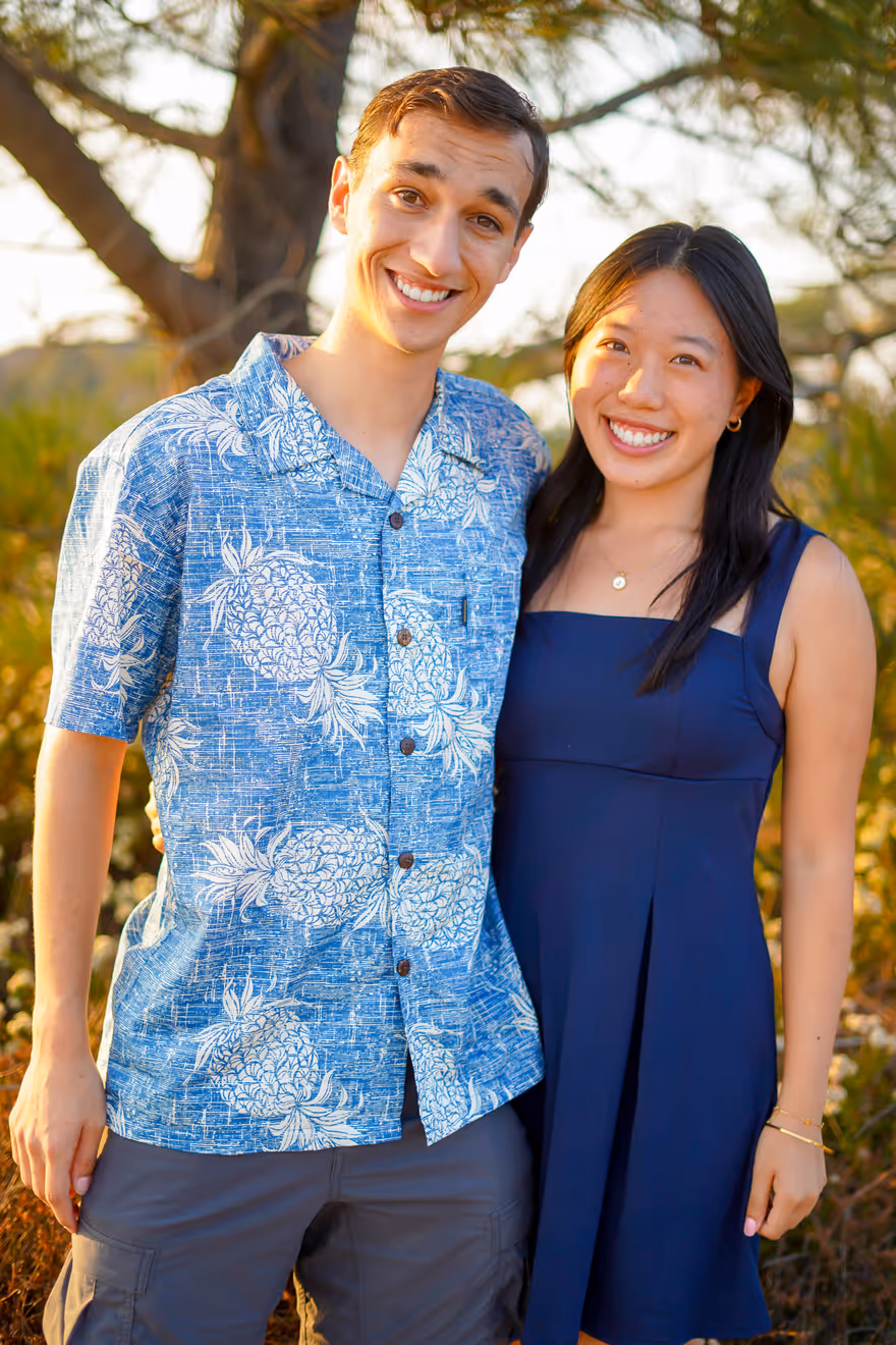 Jason and Sydney smiling outdoors